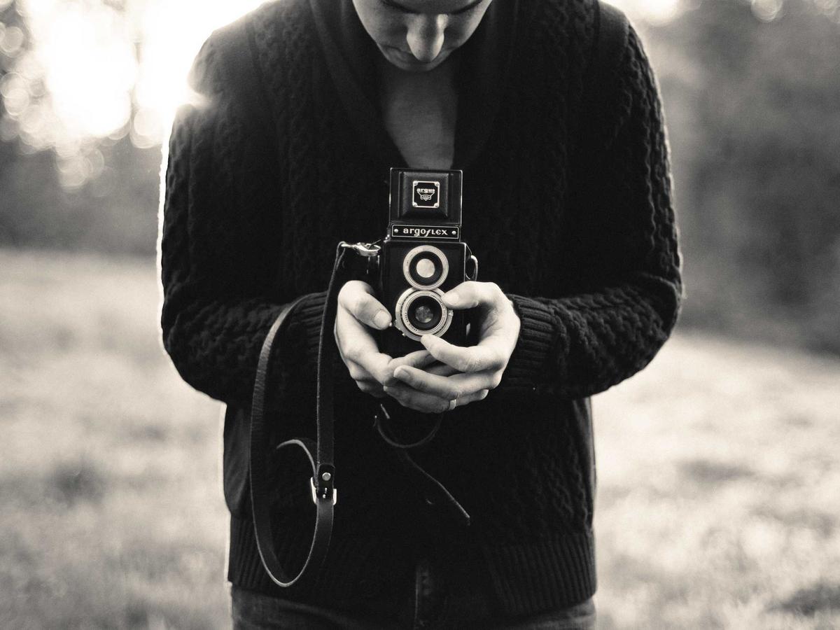 Hands holding a camera